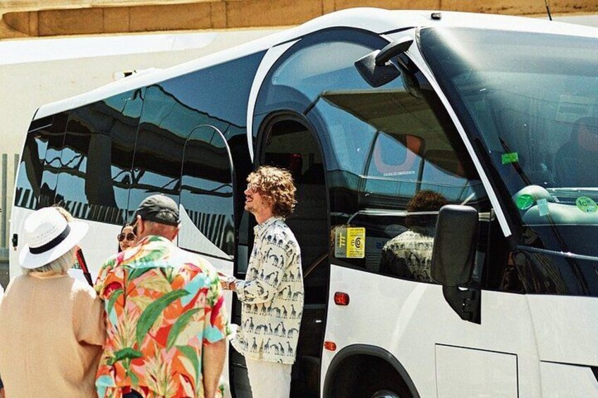A bus with people boarding. 3