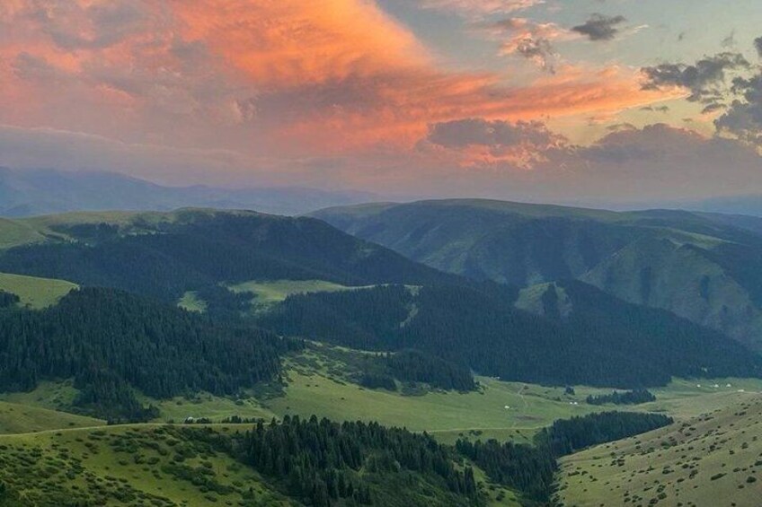Rolling hills, a valley, and a forested area. 3