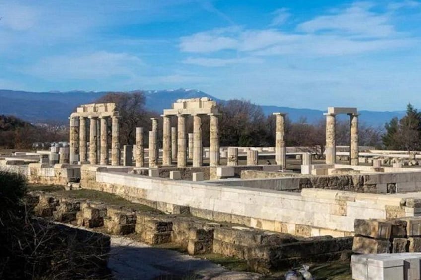 Ancient ruins with columns and stone structures. 5