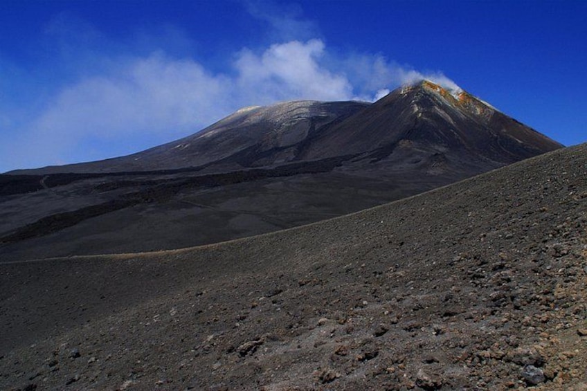 A volcanic mountain with a clear sky. 5