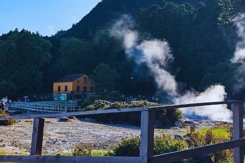 A steam vent, a wooden bridge, and a yellow building. 2