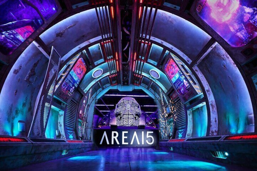 A futuristic, circular structure with neon lights and digital displays. 1