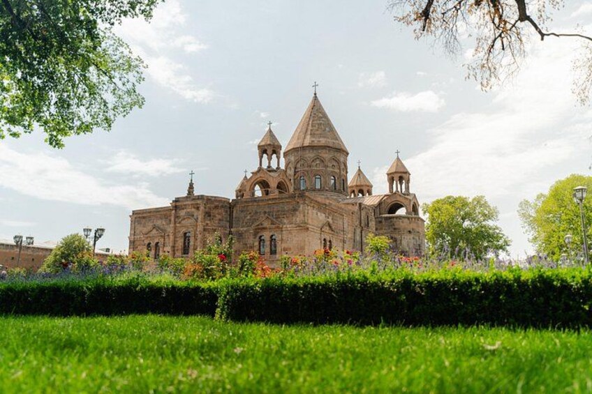 A historic church with multiple domes and a bell tower. 2