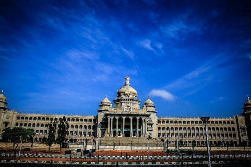 A large, ornate building with multiple domes and a central clock tower. 2