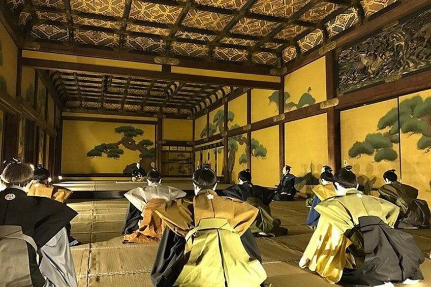 A traditional Japanese room with tatami mats, wooden beams, and paintings of nature. 5