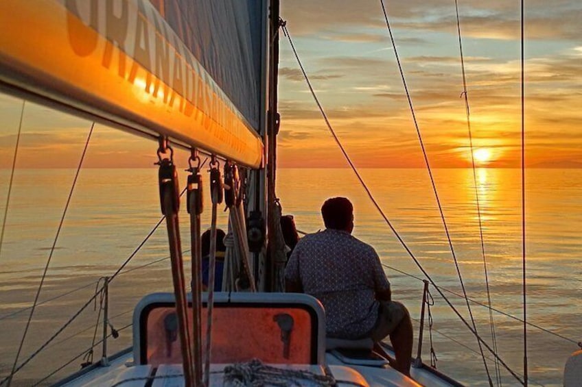 Sailing at sunset along the cliffs of Maro-Compartida 3