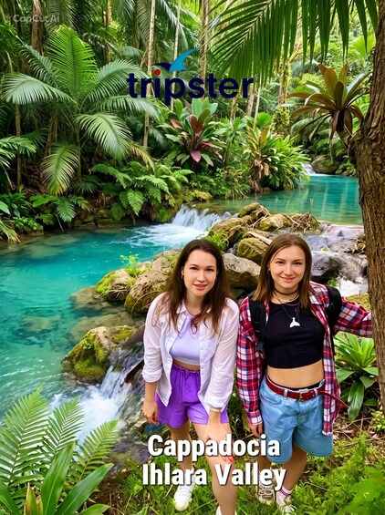 Two people standing by a waterfall in a lush green valley with clear water. 4