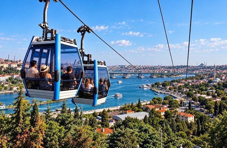 A cable car with passengers overlooking a cityscape and a river. 4