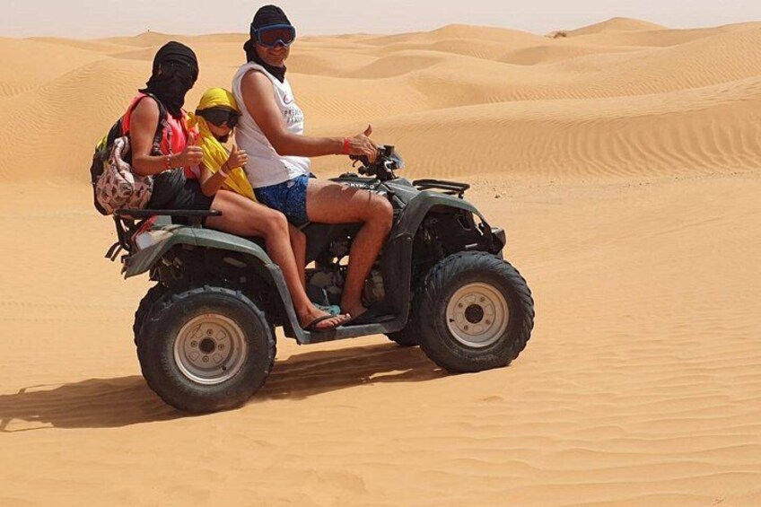A quad bike on a sandy dune. 4
