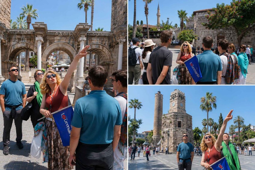 A historical site with tourists, including a prominent archway and a tower. 1
