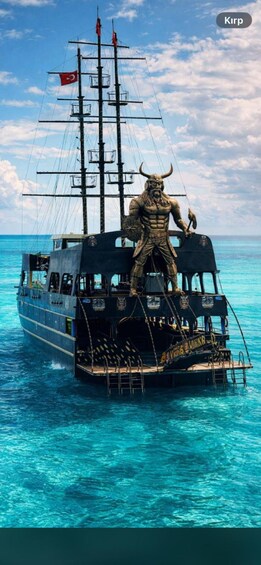 A ship with a figurehead statue, a Turkish flag, and the text 'KINGS OF THE WORLD' on the side. 1