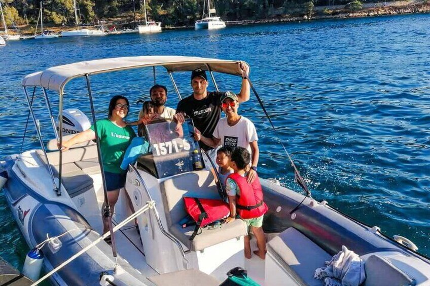 A family on a boat with a child wearing a life jacket. 4