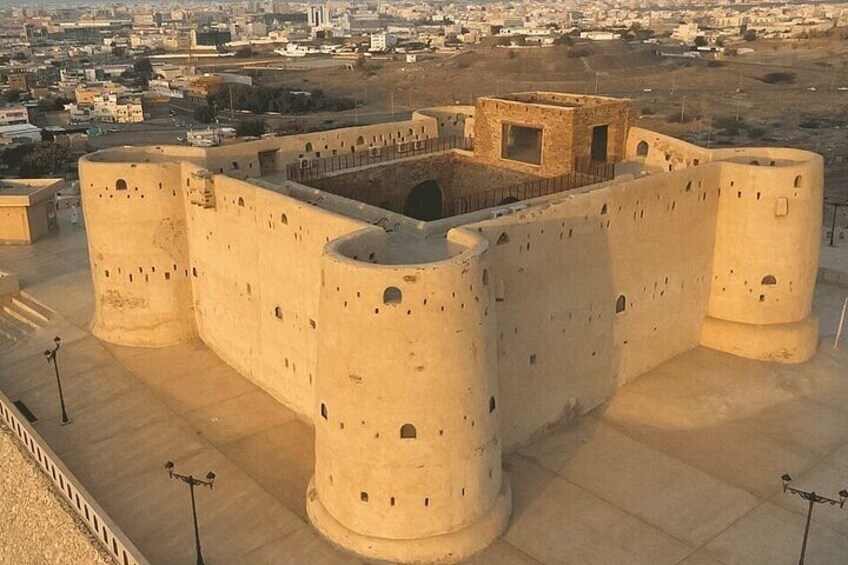 A large fortress with multiple cylindrical towers and a central courtyard. 5