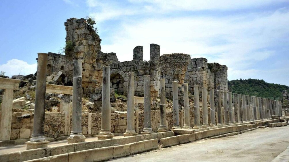 Ancient ruins with stone columns and walls. 5