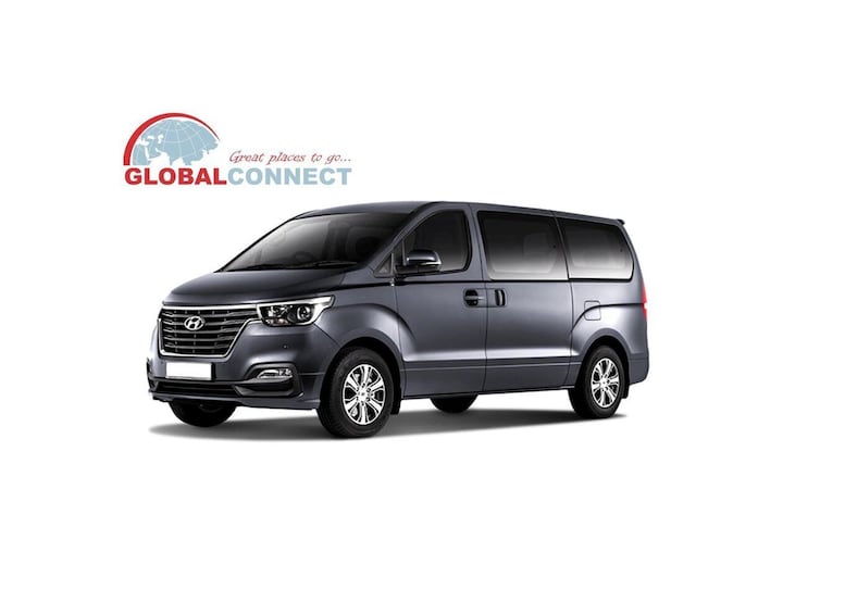 A gray Hyundai minivan with a sleek design and modern features. 3