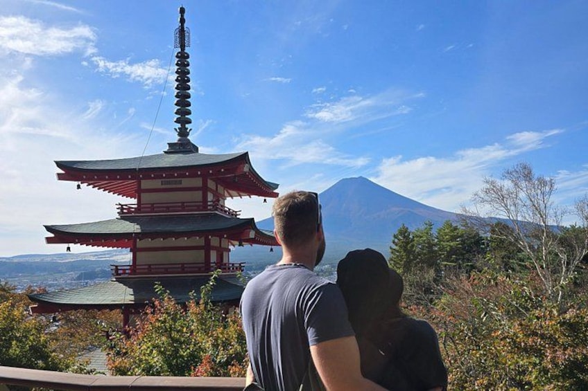 A pagoda with a mountain in the background. 2