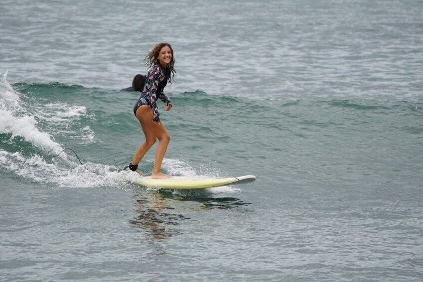 A person surfing on a wave in the ocean. 2