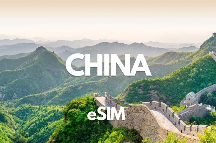 The Great Wall of China with lush green hills in the background. 1