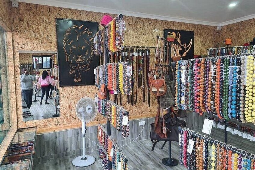 A jewelry store with various necklaces and bracelets on display. 1