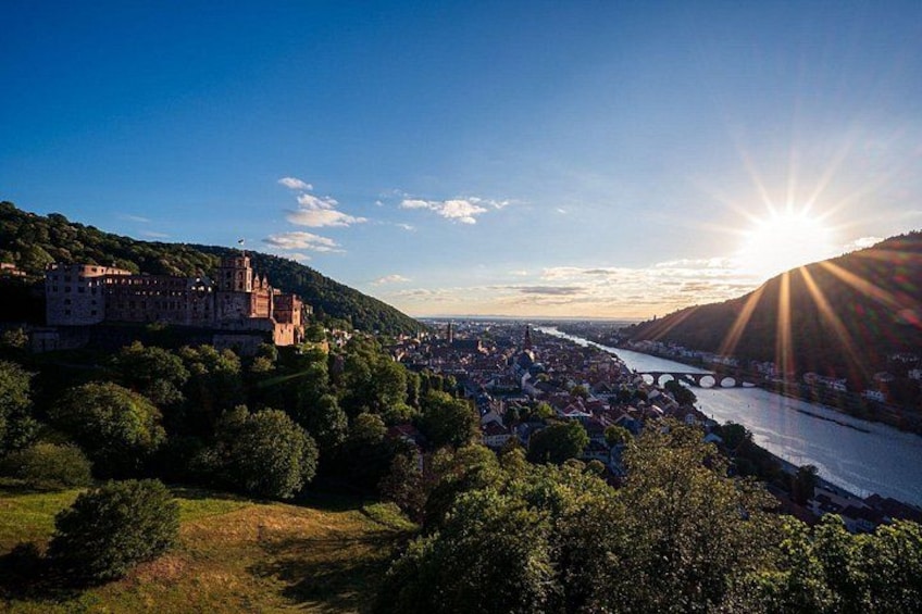A castle on a hill, a river, and a bridge. 4