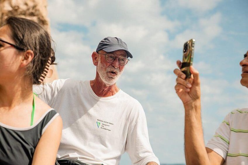 A person taking a selfie with a smartphone. 3