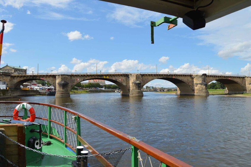 A river with a stone bridge in the background. 5