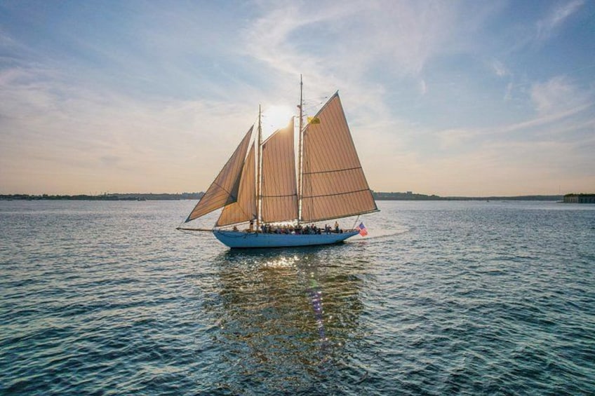 A sailboat on calm water with a clear sky. 4