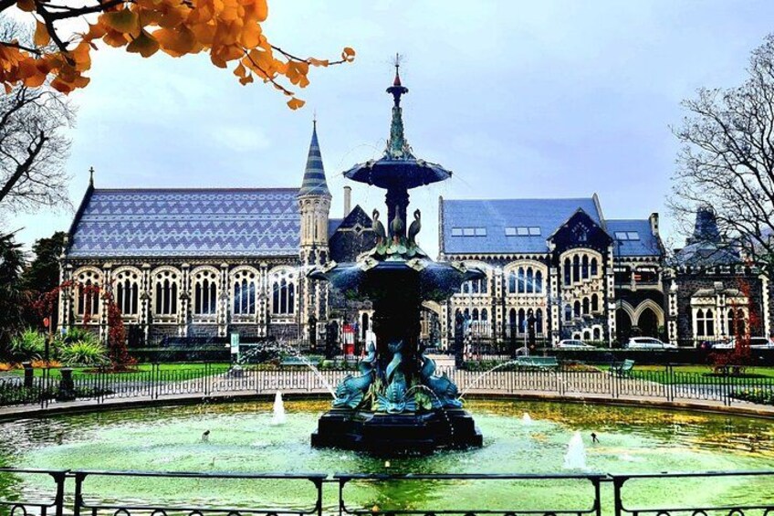 A historic building with a large fountain in front. 5