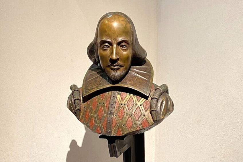 A bust sculpture with a patterned chest and a curved back. 1