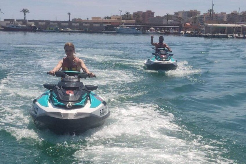 Couple on two jet skis 2
