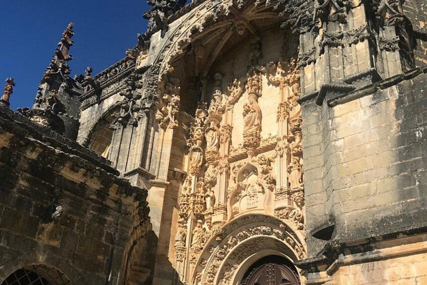 A Gothic-style cathedral facade with intricate stone carvings and statues. 4