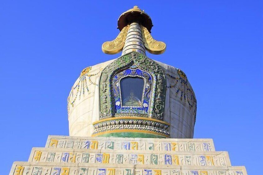 A domed structure with intricate patterns and a central window. 3