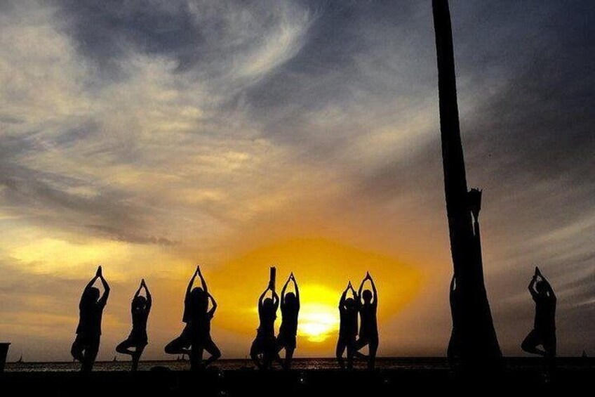 the best sunset views in waikiki are at our beach yoga spot 4