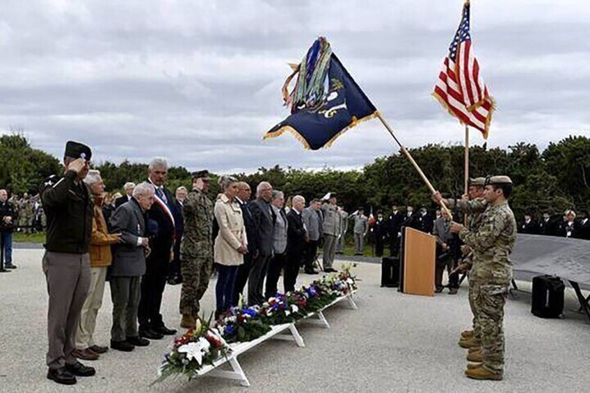 A military ceremony with a flag-raising and a wreath-laying. 5