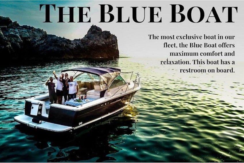 A boat named 'The Blue Boat' with a restroom on board, surrounded by calm water and rocky cliffs. 2