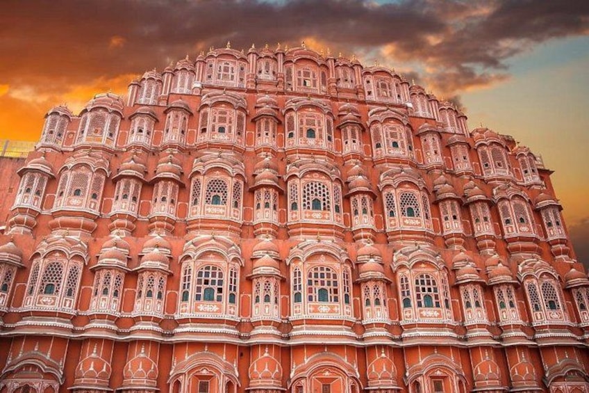 A large, ornate building with intricate architectural details and multiple windows. 3