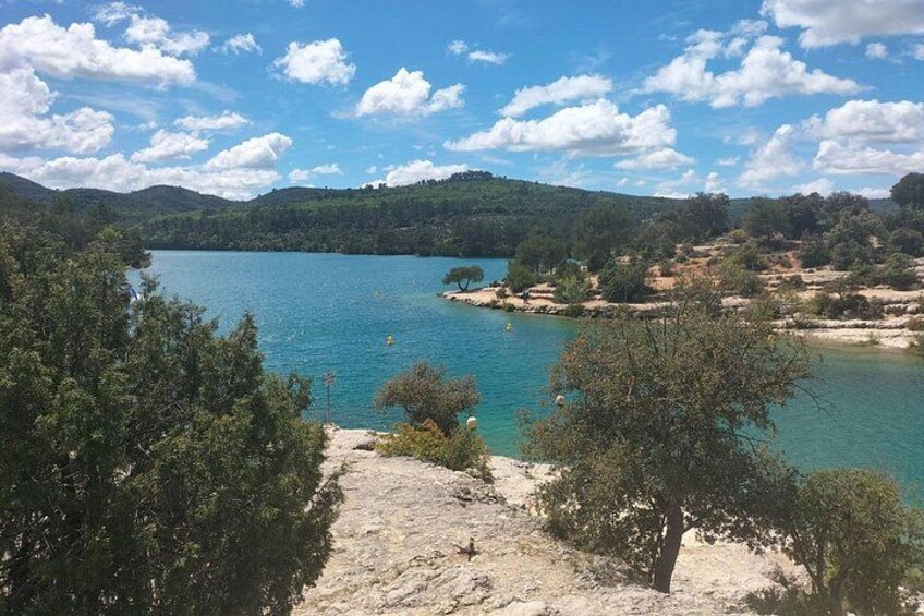A lake surrounded by hills and trees. 3