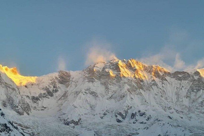 Snow-covered mountains with sunlight reflecting off the peaks. 2
