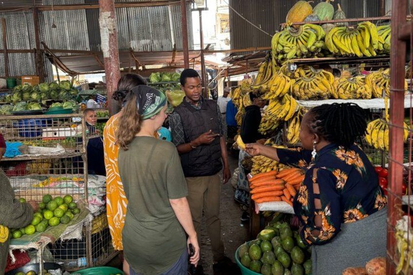 A market with various fruits and vegetables on display. 4