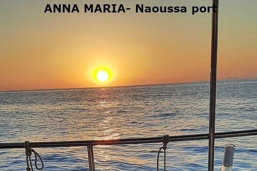 A sunset over the ocean with a boat in the foreground. 5