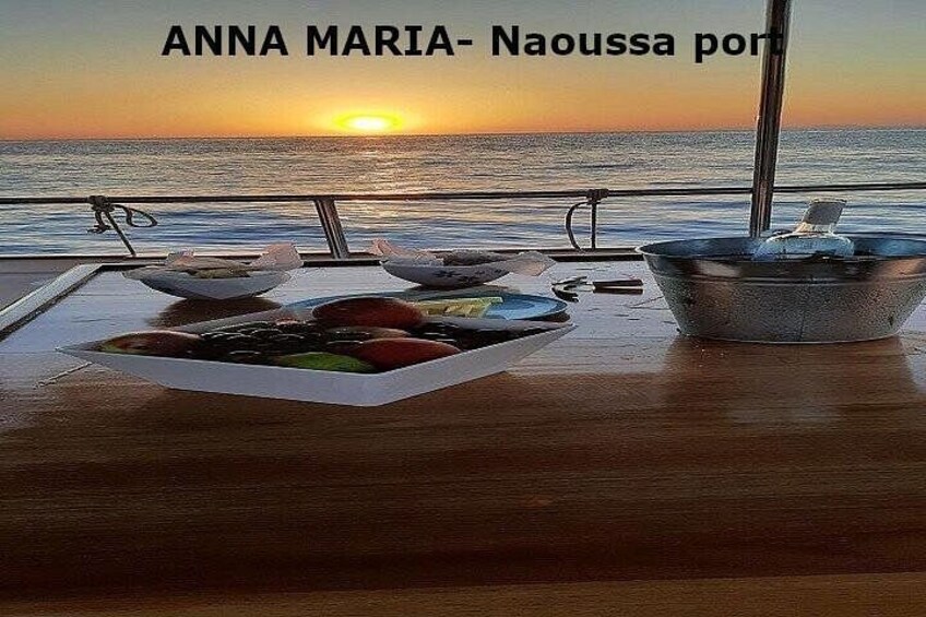 A table with food and a sunset view. 4