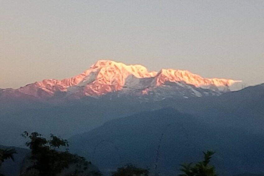 A snow-capped mountain peak with a clear sky. 2