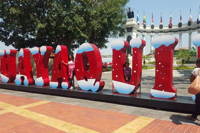 Large red letters with snow-like decorations spelling out a word. 2