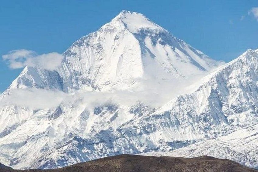 A snow-covered mountain peak with a clear sky. 3
