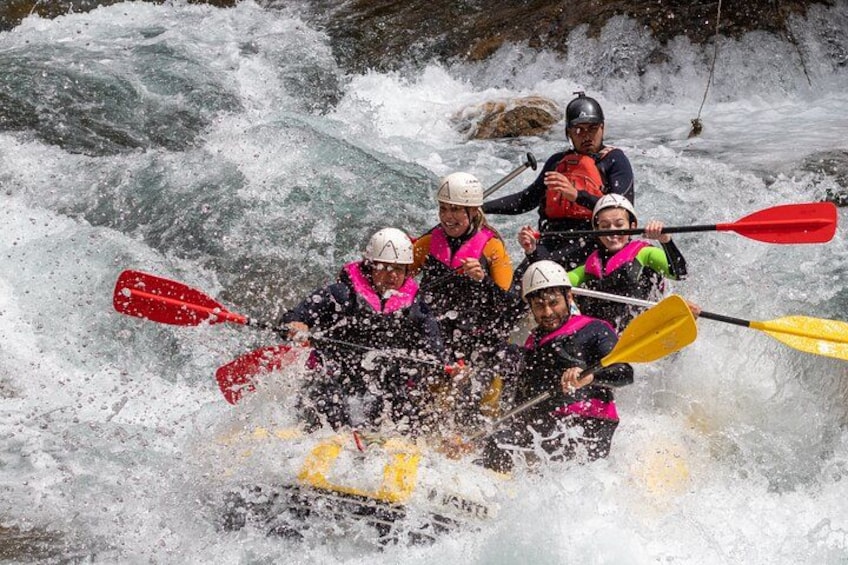 A group of people kayaking on a river. 2