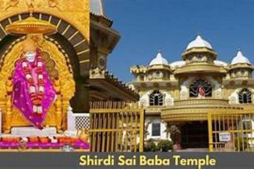The Shirdi Sai Baba Temple with a large statue and ornate architecture. 3