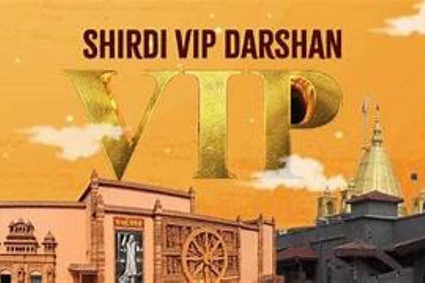 A building with a large golden 'V' and 'P' sign, and the text 'SHIRDI VIP DARSHAN' above it. 2