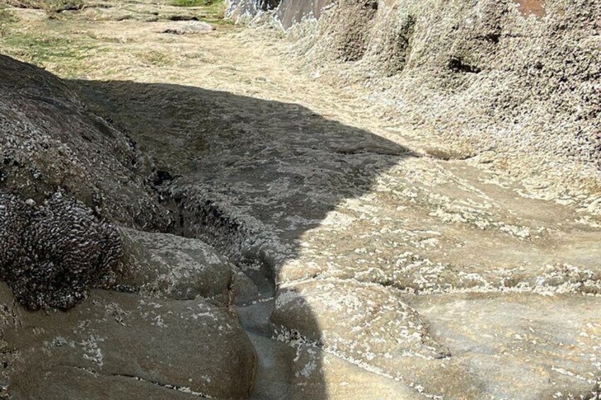 A rocky terrain with a narrow water channel. 2