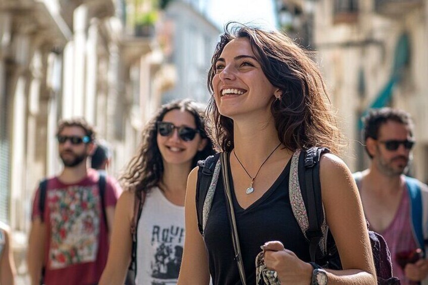 A person walking on a street with buildings in the background. 2