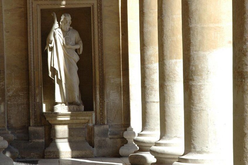 A classical statue in a niche, surrounded by columns. 3